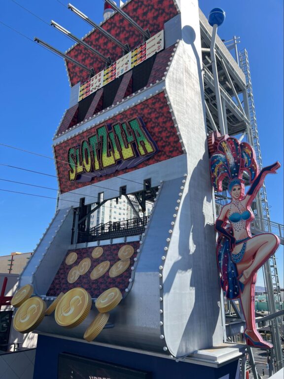 The ZipZilla and Super-Hero Zoom ziplines, the famous Vegas showgirl, the coins toppling out of SlotZilla and the massive slot machine handle.