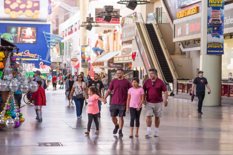 family walking down fremont street experience