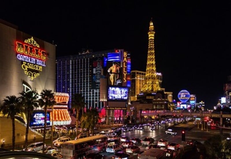 Bright lights of the cars, casinos, restaurants, and hotels in Downtown Las Vegas.