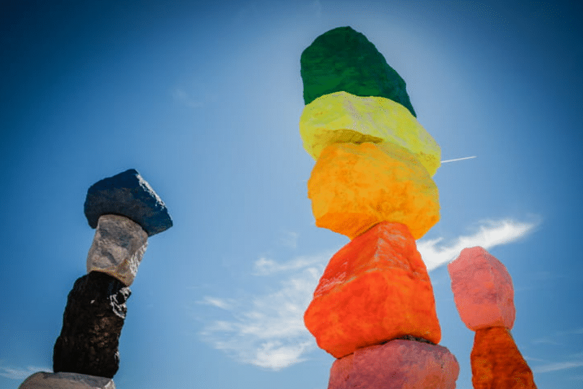 Colored rocks stacked upon one another which creates the Seven Magic Mountains in Las Vegas, Nevada. It is an art installation by Ugo Rondinone.