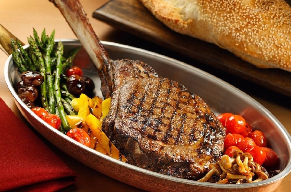 A steak and veggies prepared by Andiamo Steakhouse at the D.