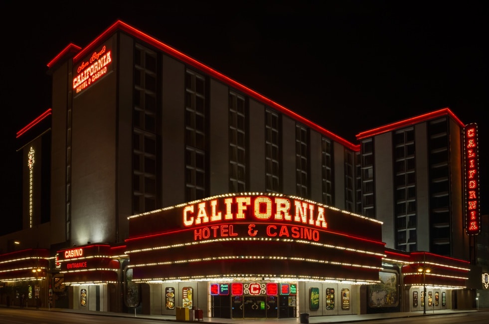 An outside view of The California Hotel & Casino at night.