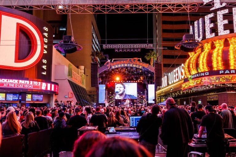 A crowd watching a live band outside The D and 4 Queens at the Fremont Street Experience. 