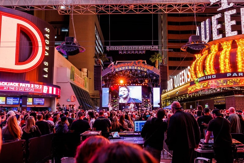 A crowd watching a live band outside The D and 4 Queens at the Fremont Street Experience.